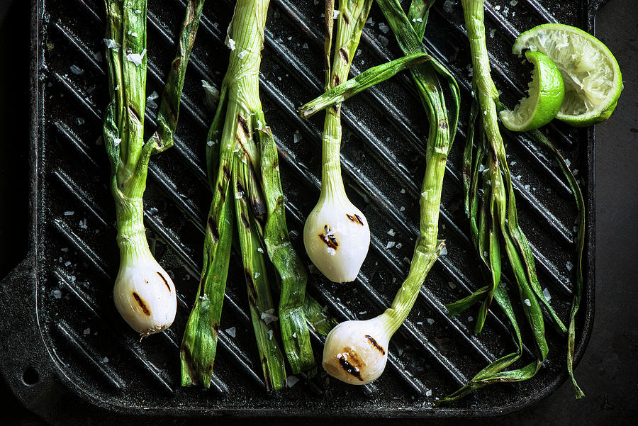 Cebollitas grilled Green Onion Bulbs On Csat Iron Griddle With Squeezed Lime Photograph by Justin B. Paris
