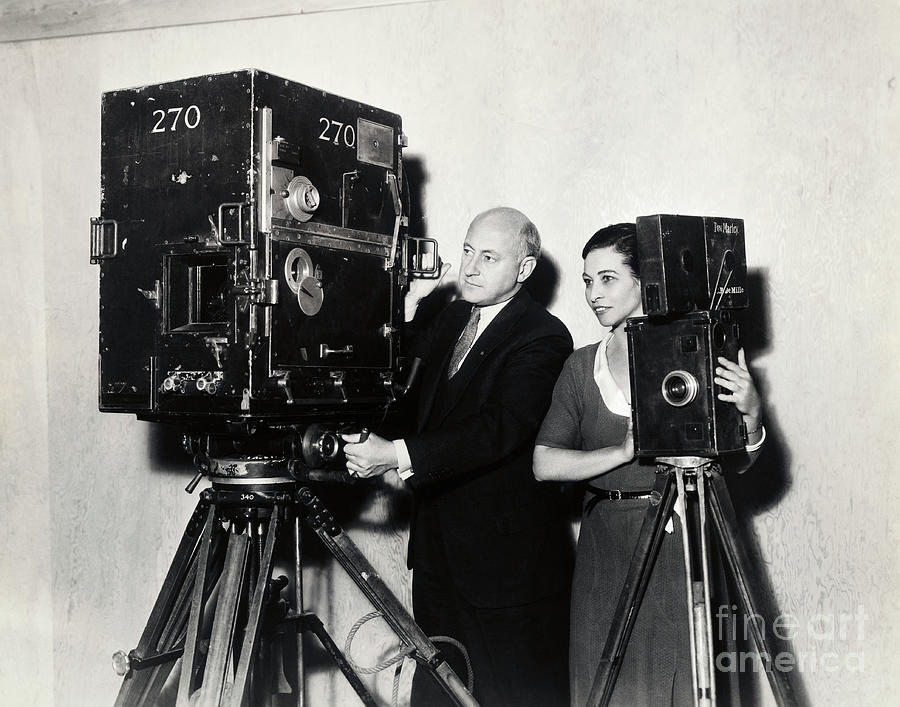 Cecil B. Demille With Old And New Movie Photograph by Bettmann