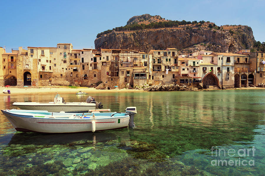 Architecture Photograph - Cefalu old town and harbor with city beach and clear sea in Sicily by IPics Photography