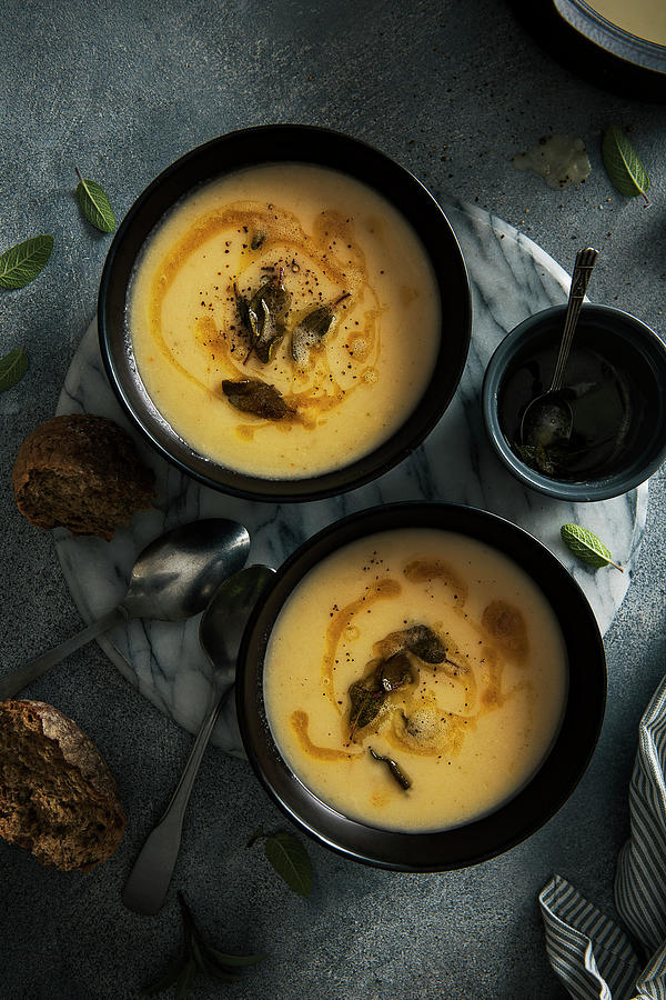 Celeriac, Apple And Sage Soup With Brown Butter Fried Sage Leaves Photograph by Magdalena Hendey