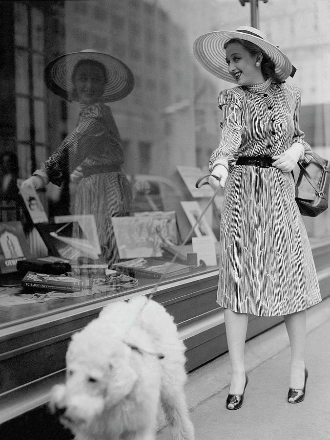 Celeste Holm Walking Her Dog Past Store Windows Photograph by Constantin Joffe