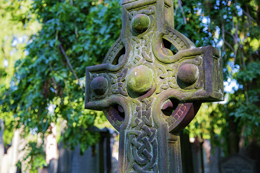 Celtic Cross Gravestone Adorned With Moss Border And Background Trees ...