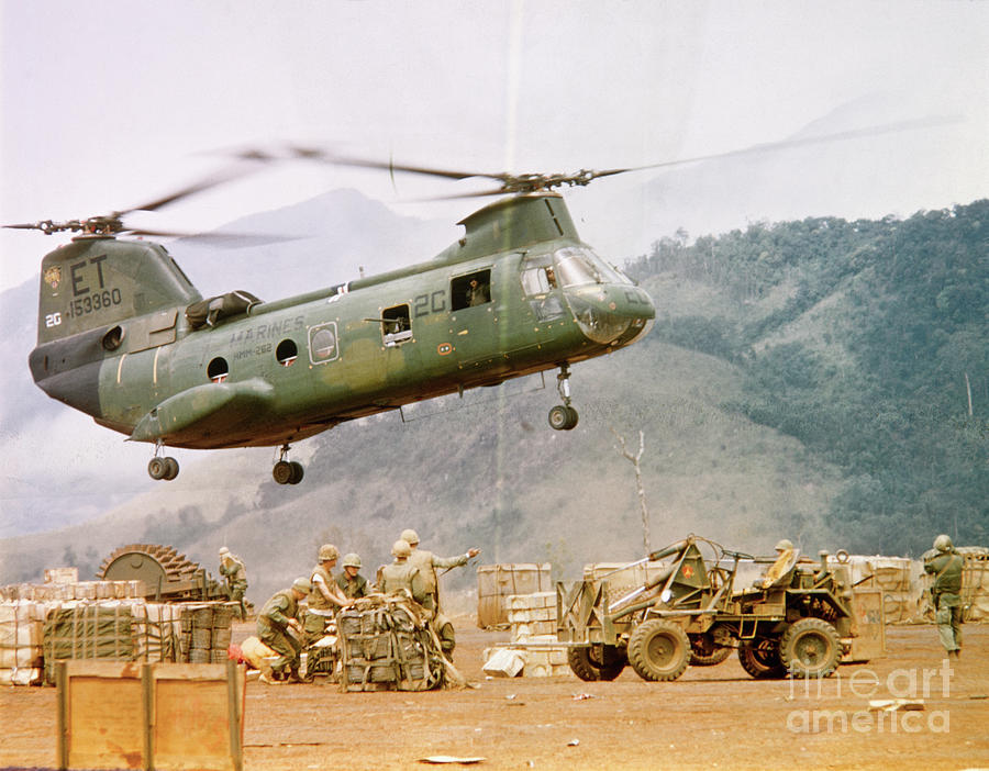 Ch-46 Helicopter Picking Up Supplies Photograph by Bettmann