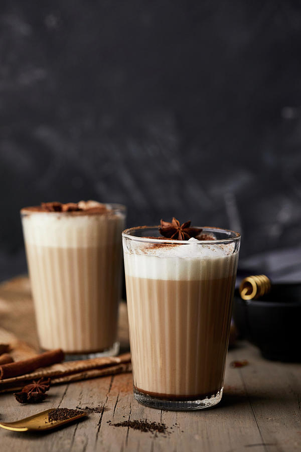 Chai Latte In Glasses With Milk Foam And Anise Stars Photograph by Natasa Dangubic
