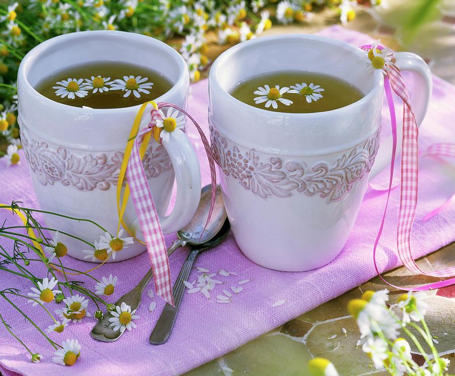 Chamomile Flower Tea In Two Mugs With Ribbons Photograph by Strauss, Friedrich