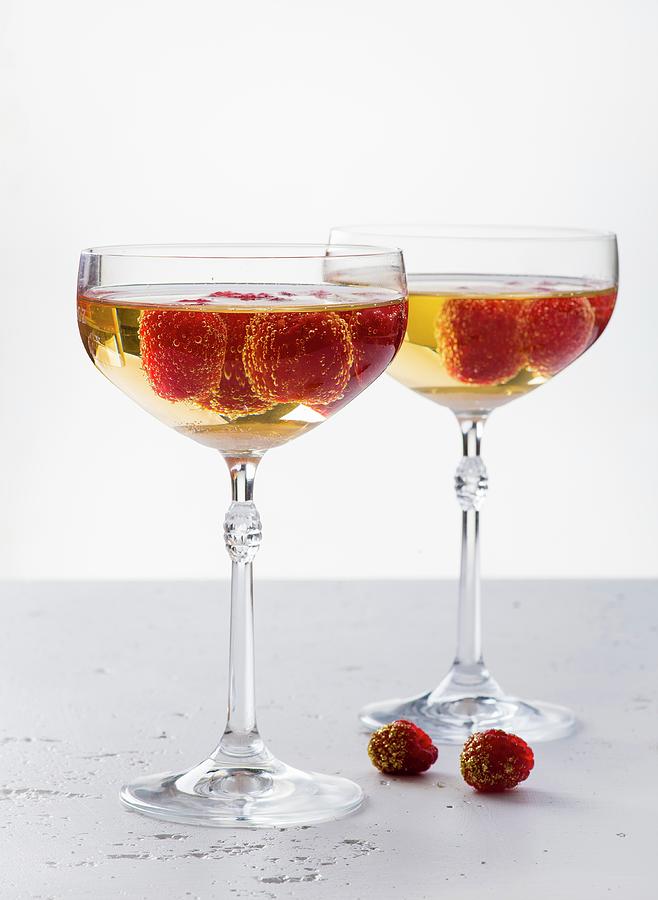 Champagne Cocktails With Gold-dusted Raspberries Photograph by Great Stock!