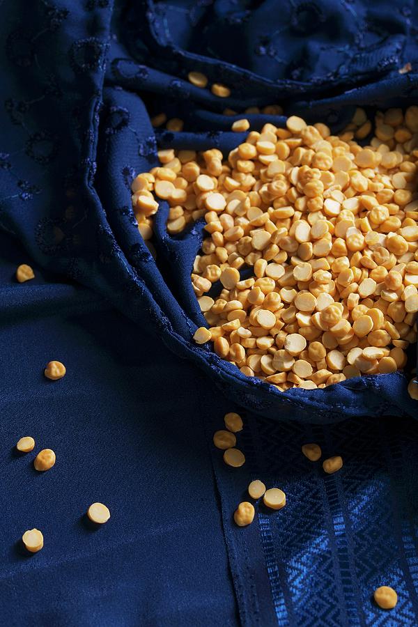 Chana Dhal yellow Lentils In A Blue Silk Sari Photograph by Mandy Reschke