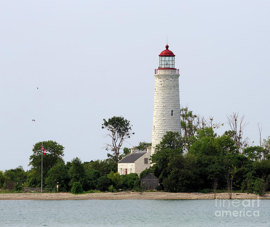 Chantry Island Lighthouse and Lightkeepers cottage on Lake Huron Photograph by Louise Heusinkveld