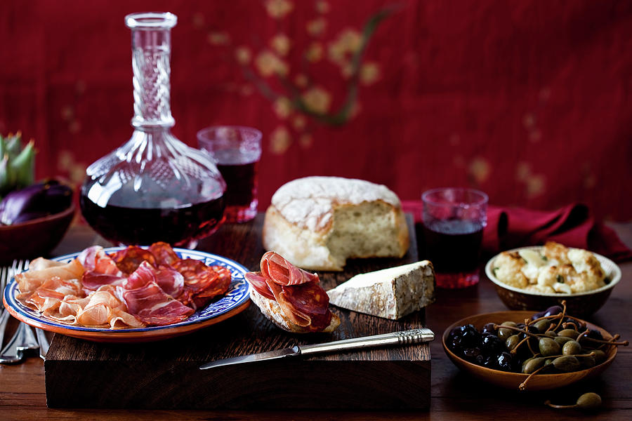 Charcuterie Still Life With Olives, Cauliflower, Cheese, Bread, Artichokes, And Wine Photograph by Leo Gong