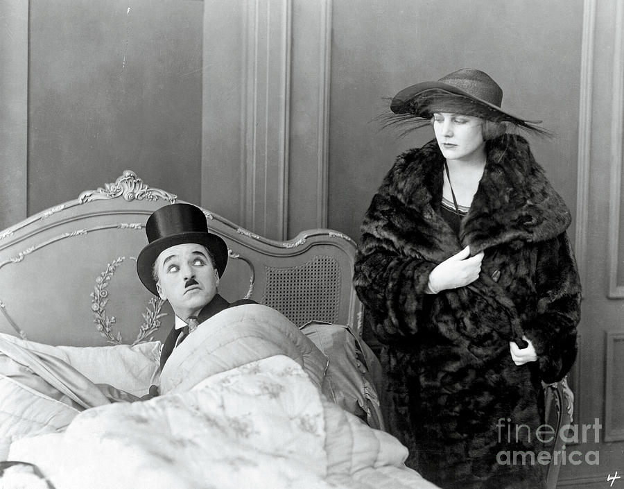 Charlie Chaplin And Edna Purviance Photograph by Bettmann