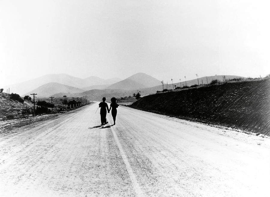 CHARLIE CHAPLIN and PAULETTE GODDARD in MODERN TIMES -1936-. Photograph by Album