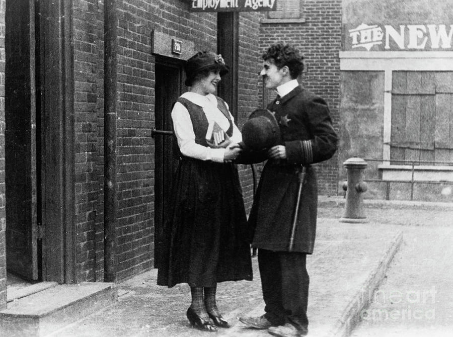 Charlie Chaplin In Police Uniform Photograph by Bettmann