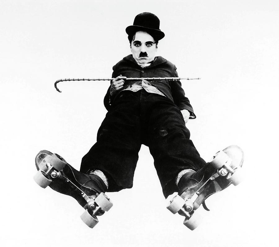 CHARLIE CHAPLIN in THE RINK -1916-. Photograph by Album