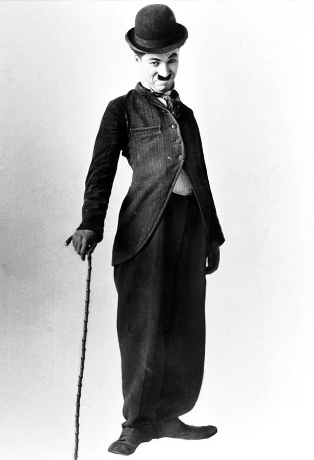CHARLIE CHAPLIN in THE TRAMP -1915-. Photograph by Album
