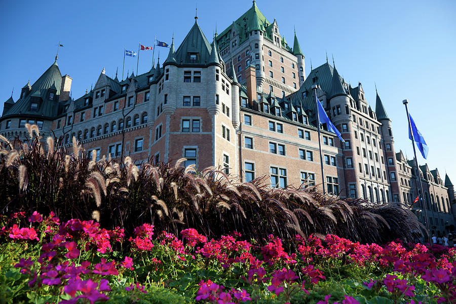 Chateau Frontenac With Flowers In Photograph by Onfokus