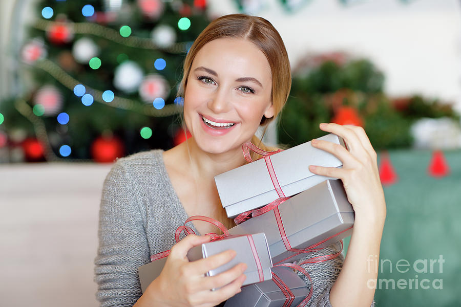 Cheerful female with Christmas gifts Photograph by Anna Om