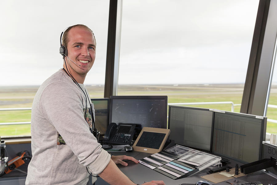 cheerful-flight-operations-officer-during-work-photograph-by-cavan