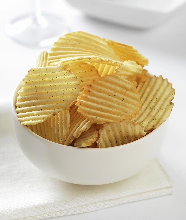 Cheese And Onion Crinkle Potato Crisps In A Bowl Photograph by Robert Morris