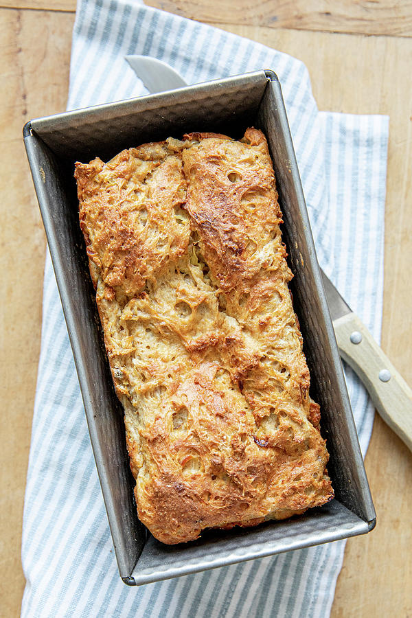 Cheese Bread In A Baking Tin Photograph by Claudia Timmann