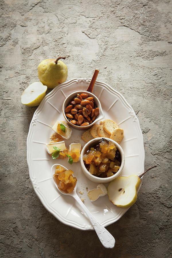 Cheese Canaps With A Spicy Pear Compote Served With Rosemary Almonds And Bread Crisps Photograph by Great Stock!