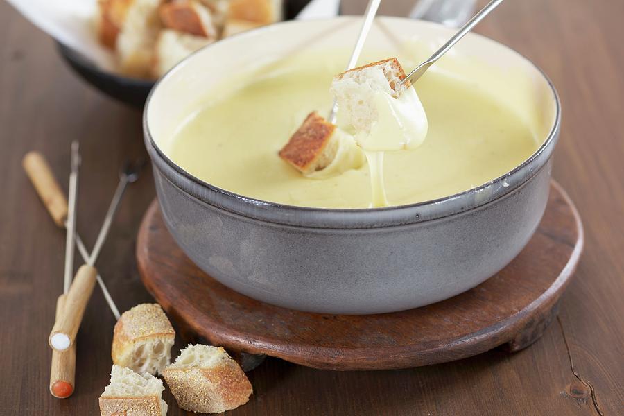 Cheese Fondue With Cubes Of White Bread Photograph by Eising Studio - Food Photo & Video