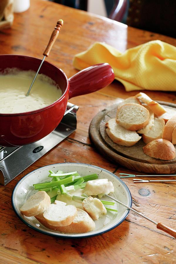 Cheese Fondue With Spring Onions And A Baguette Photograph by Sven