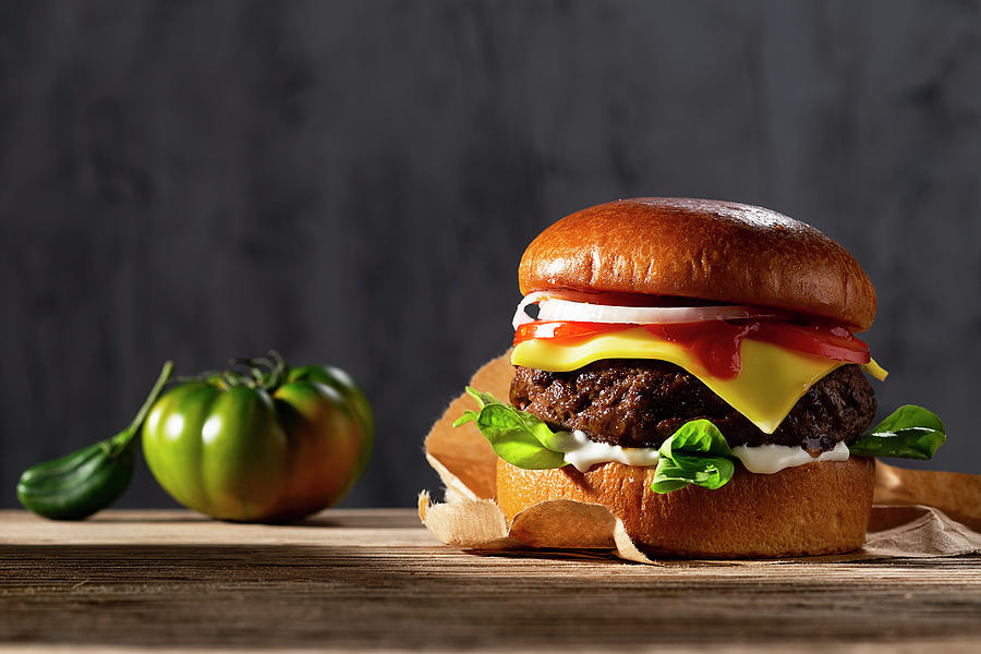 Cheeseburger With Ketchup And Onions Photograph by Christian Schuster