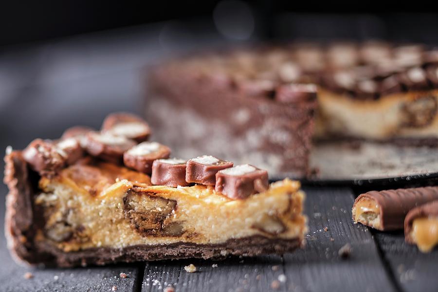 Cheesecake With Chocolate And Caramel Biscuit Bars Photograph by Jan Prerovsky