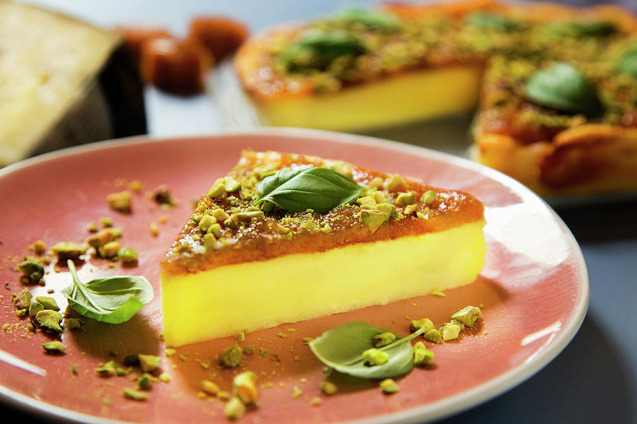 Cheesecake With Quince Jelly And Pistachios Photograph by Albert Gonzalez