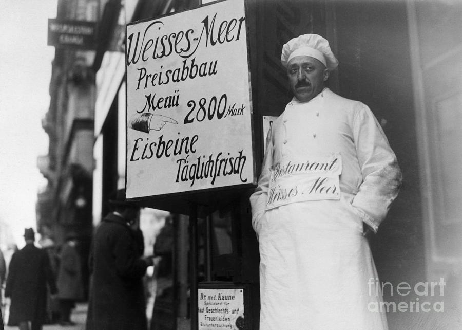 Chef Stands In Door By Restaurant Sign Photograph by Bettmann