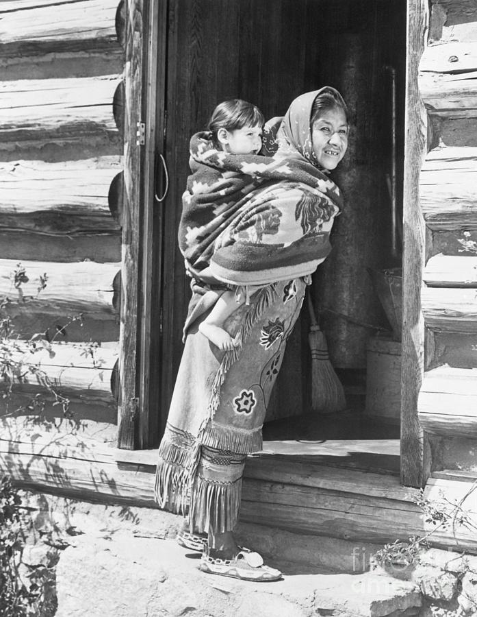 Cherokee Woman Carrying Child Photograph by Bettmann