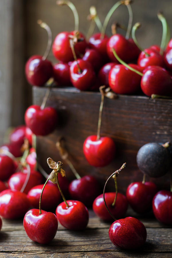 Cherries In A Wooden Crate And On A Table Photograph by Joanna Lewicka