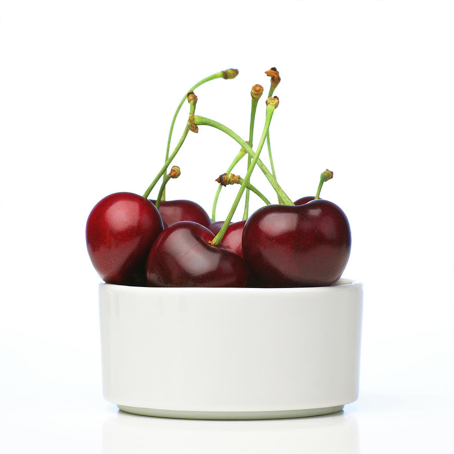 Cherries In White Bowl Photograph by Maria Toutoudaki