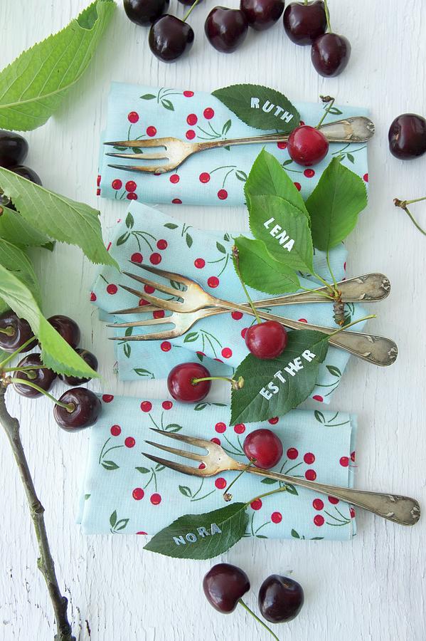 Cherries, Napkins, Cake Forks And Names Written On Cherry Leaves Photograph by Martina Schindler