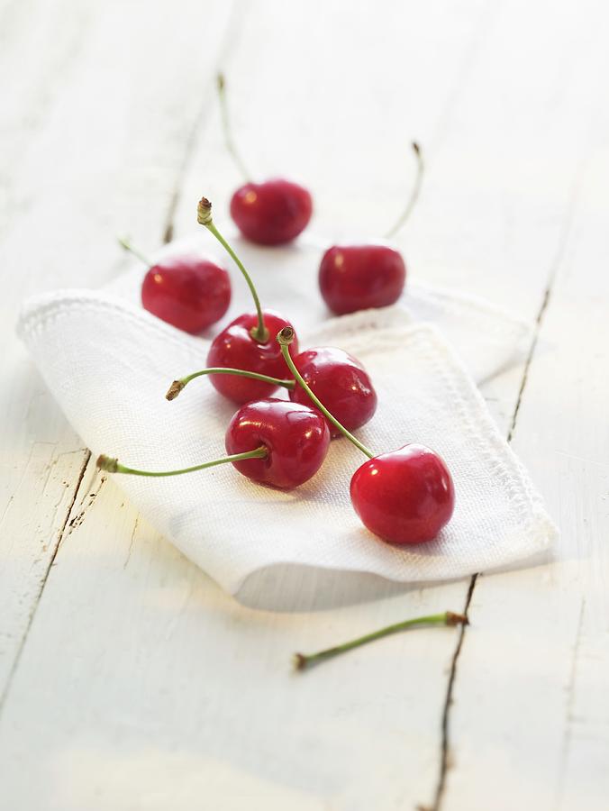 Cherries On A Cloth Photograph by Foodfoto Kln