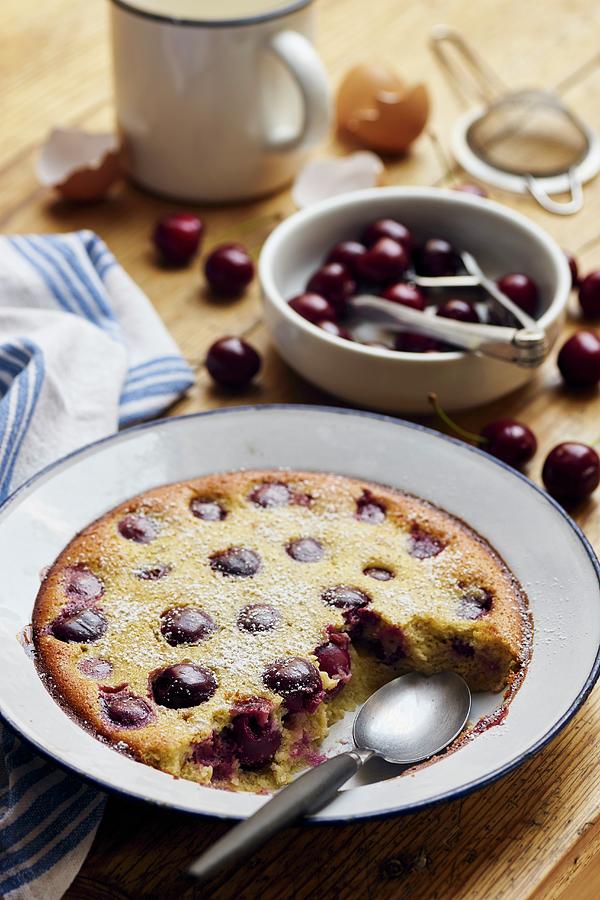 Cherry Clafoutis On A Rustic Wooden Table Photograph by Ulrike Emmert