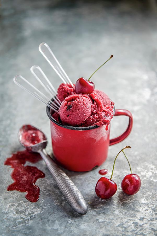 Cherry Sorbet In An Enamel Cup With Spoons Photograph by Magdalena Hendey