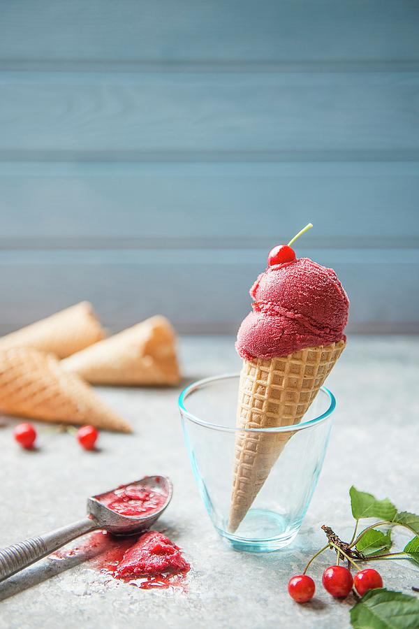 Cherry Sorbet In An Ice Cream Cone With Freash Cherries Photograph by Magdalena Hendey