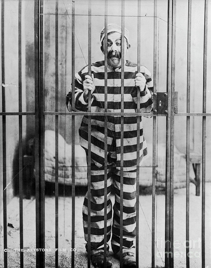 Chester Conklin Behind Bars In Dodging Photograph by Bettmann