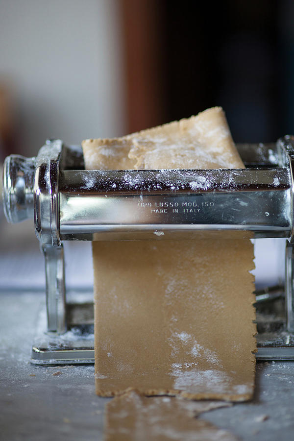 Chestnut Pasta Dough In A Pasta Machine Photograph by Eising Studio