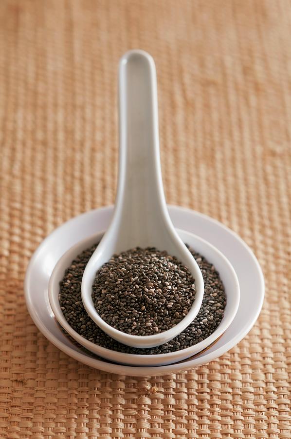 Chia Seeds On A Plate And In An Oriental Spoon Photograph by Flvio Coelho
