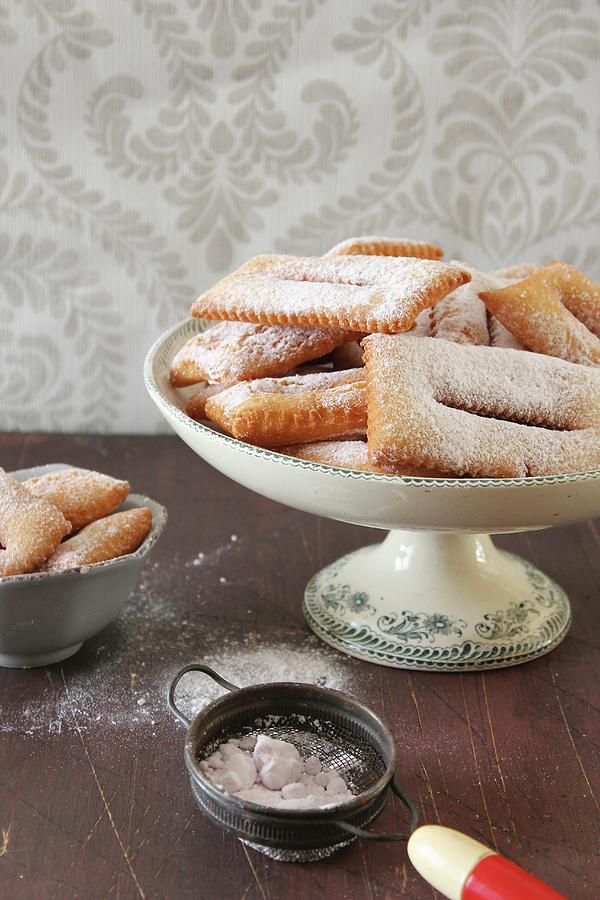 Chiacchiere deep-fried Italian Pastries With Icing Sugar Photograph by Patricia Miceli