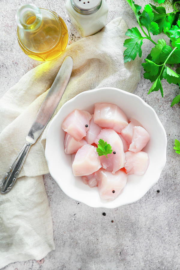 Chicken Breast In Small Pieces Ready To Cook Photograph by Claudia Gargioni