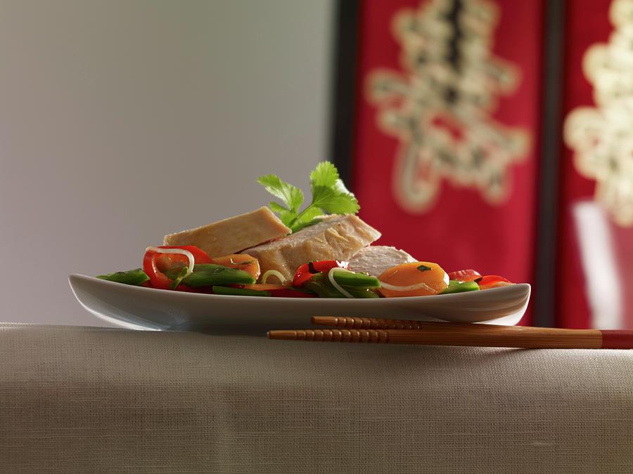 Chicken Breast On A Bed Of Stir-fried Vegetables Photograph by Studio R. Schmitz