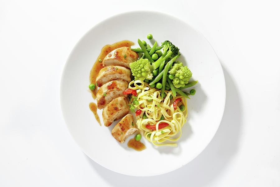 Chicken Breast With Tagliatelle And Vegetables Photograph by Alessandra Pizzi