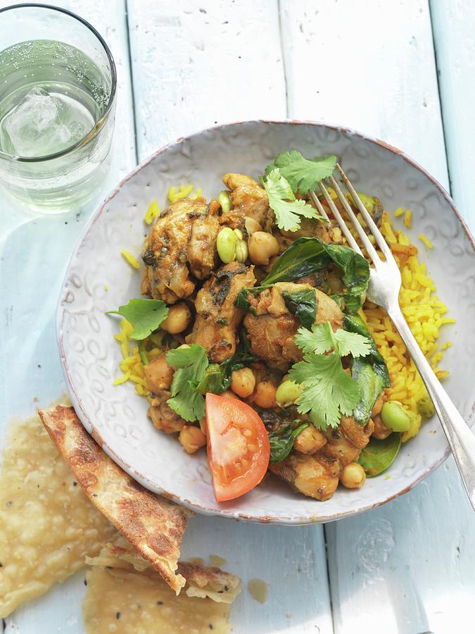 Chicken Curry With Chickpeas, Beans And Coriander On A Bed Of Rice Photograph by Jonathan Gregson