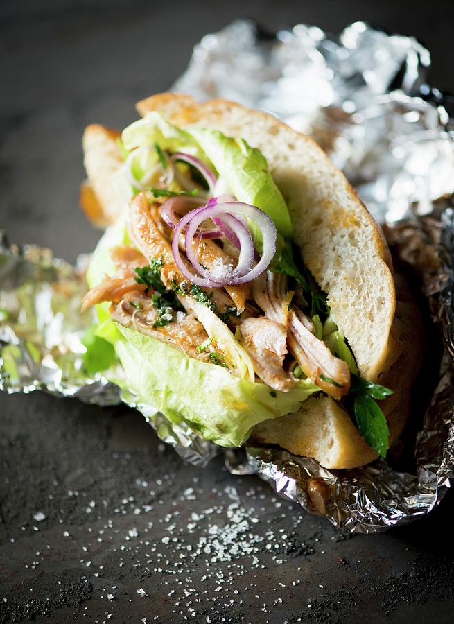 Chicken Donner With Lettuce And Onions As A Takeaway Photograph by Manuela Rther