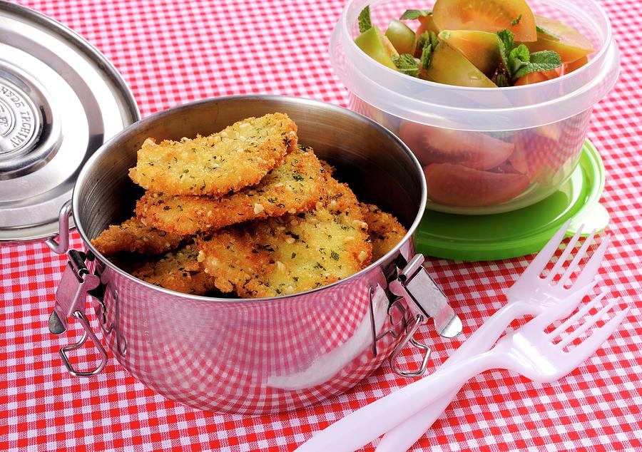 Chicken Esclaopes In Breadcrumbs With Tomato & Peppermint Salad Photograph by Franco Pizzochero
