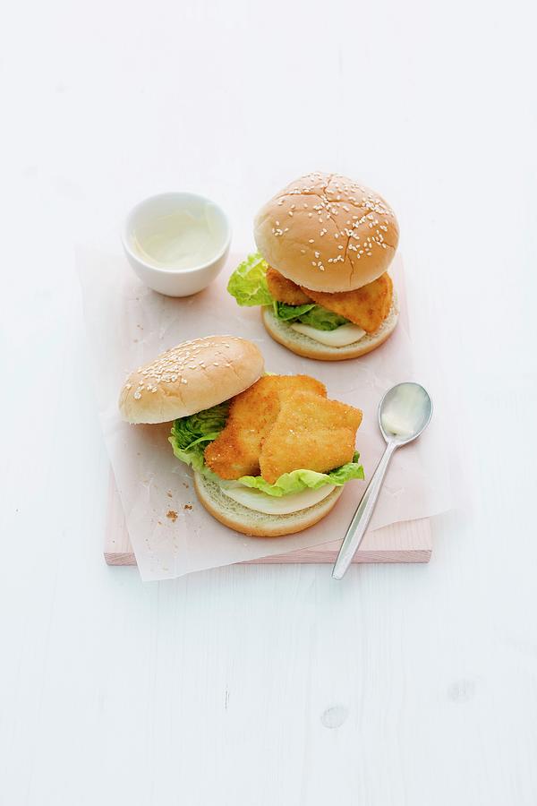Chicken Fillet Burgers With Lettuce And Mayonnaise Photograph by Michael Wissing