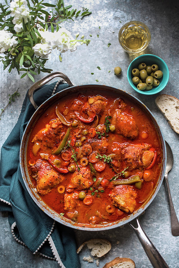 Chicken It Tomato Sauce With Chorizo Sausage, Peppers Olives And Thyme Photograph by Magdalena Hendey